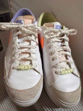 Nike White Sneakers with Orange Swoosh and Pastel Green Lining